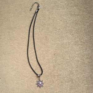 Black cord choker with sun charm